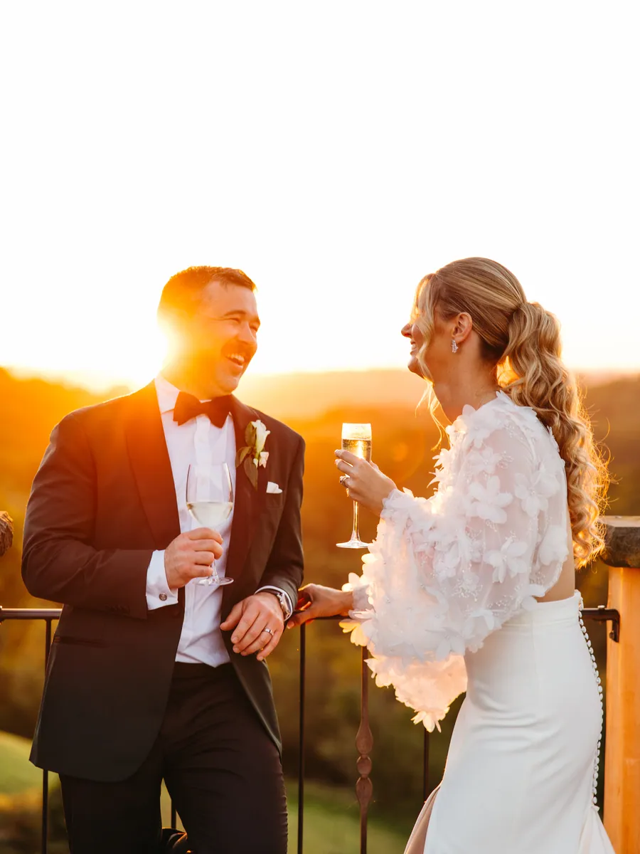 Couple toasting with champagne in the golden light